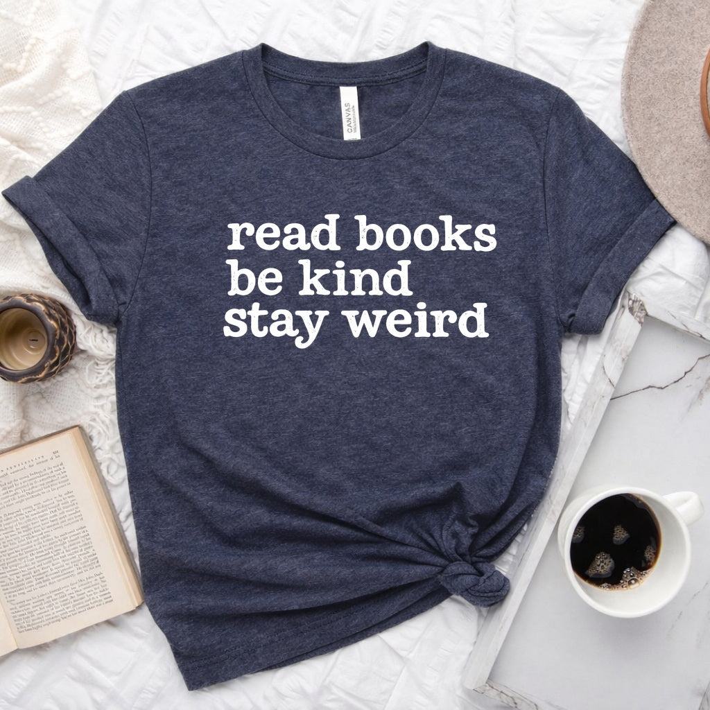 Read Books Be Kind Stay Weird distressed text graphic on a unisex crew neck tee for book lovers