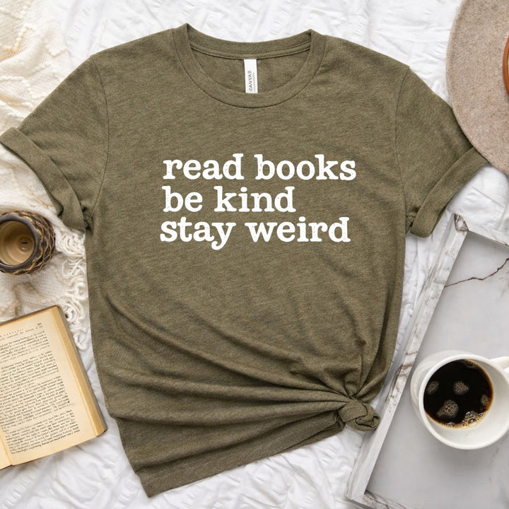 Read Books Be Kind Stay Weird distressed text graphic on a unisex crew neck tee for book lovers