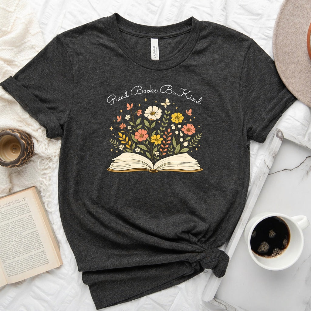 Unisex book lover tee featuring a vintage-style open book with wildflowers, cosmos, and butterflies blooming from the pages
