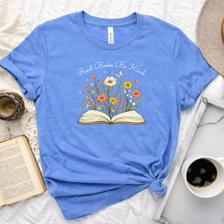 Unisex book lover tee featuring a vintage-style open book with wildflowers, cosmos, and butterflies blooming from the pages
