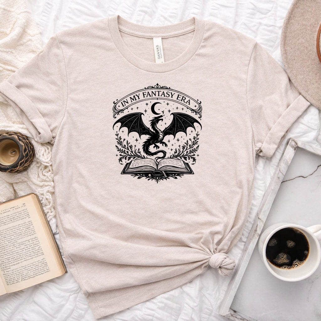 In My Fantasy Era unisex tee with dragon, crescent moon, stars and open book design for book lovers