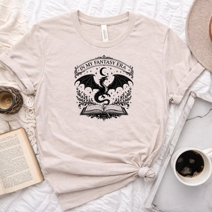 In My Fantasy Era unisex tee with dragon, crescent moon, stars and open book design for book lovers