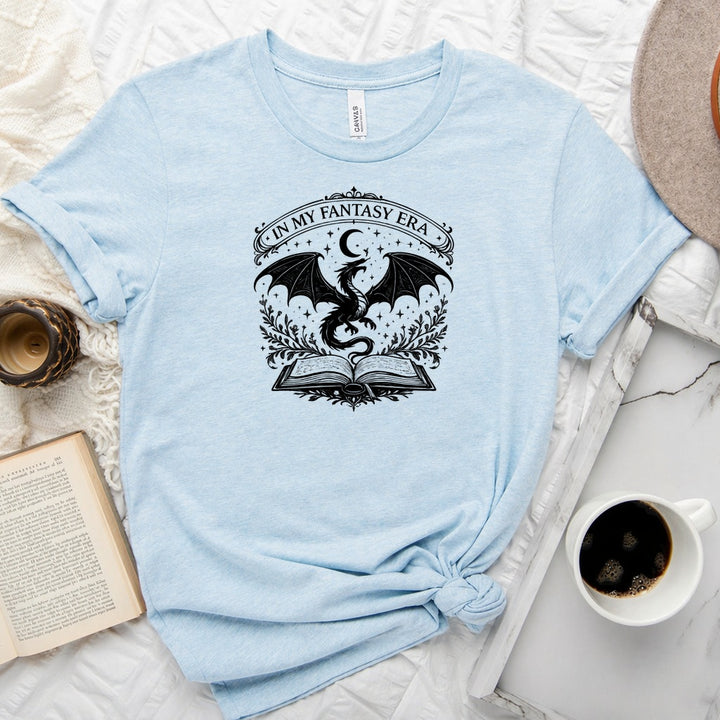 In My Fantasy Era unisex tee with dragon, crescent moon, stars and open book design for book lovers