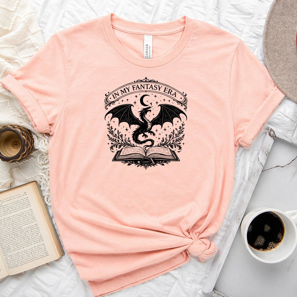 In My Fantasy Era unisex tee with dragon, crescent moon, stars and open book design for book lovers