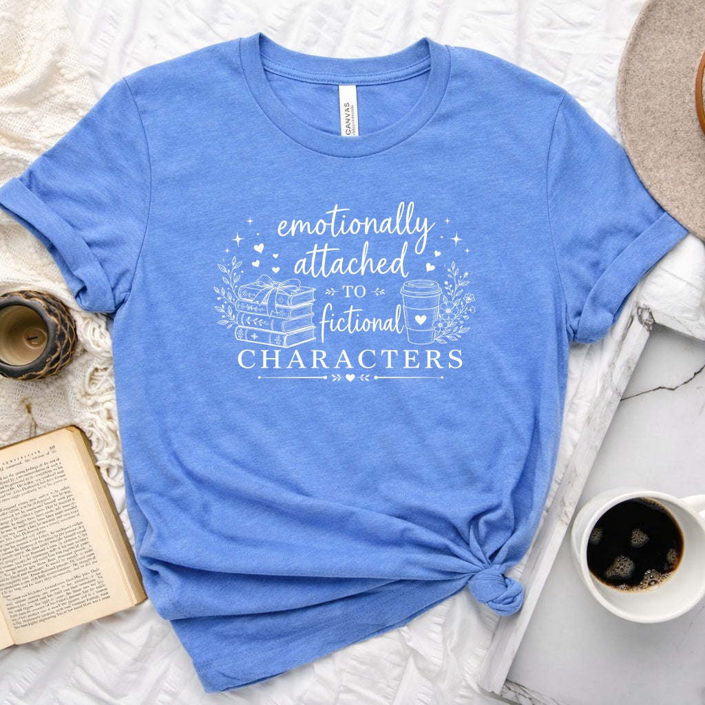 Emotionally attached to fictional characters bookish graphic unisex tee with stacked books and floral wreath design