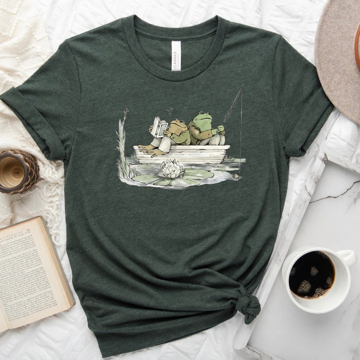 Frog reading and fishing graphic on a soft unisex crew neck tee, perfect for book lovers