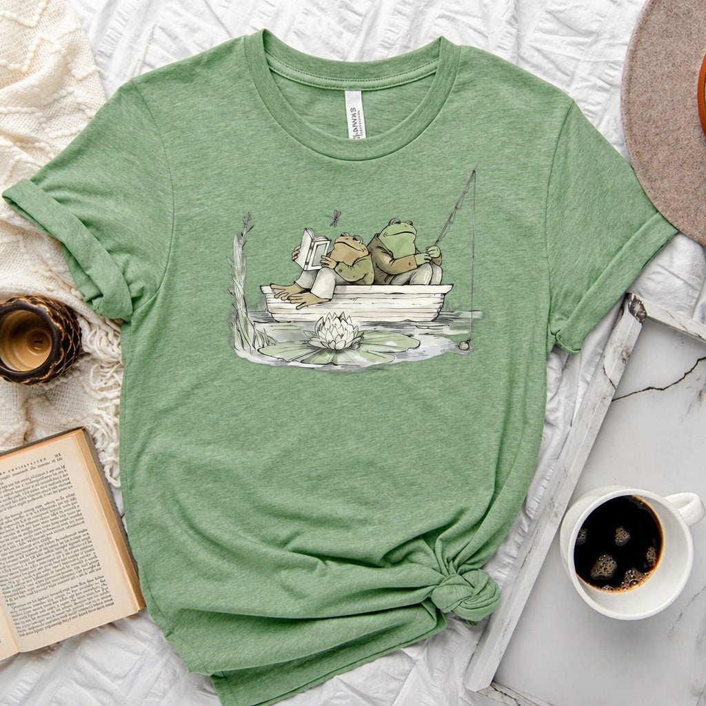 Frog reading and fishing graphic on a soft unisex crew neck tee, perfect for book lovers